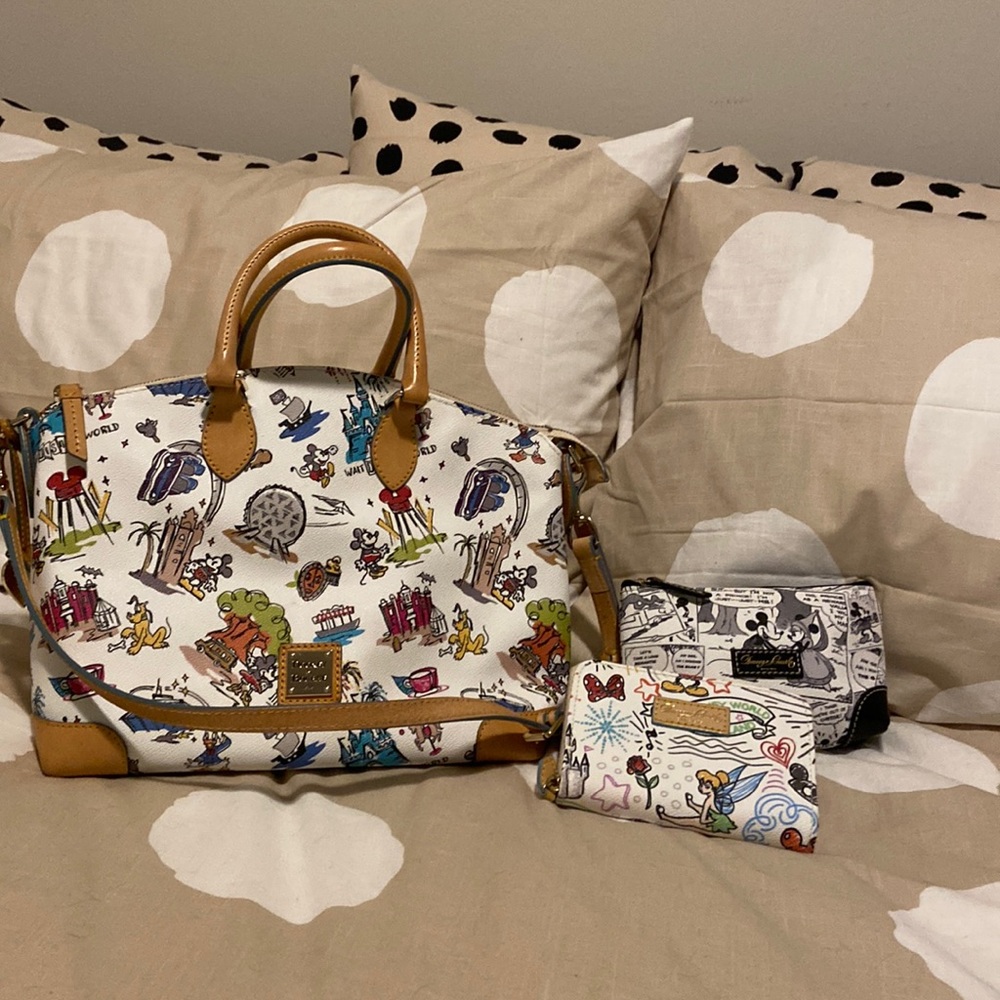 Dooney & Bourke Disney World Purse with charm,wallet, mini bag and dust bag.